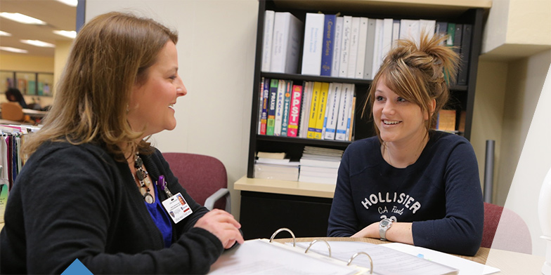 Student meeting with counselor about requirements